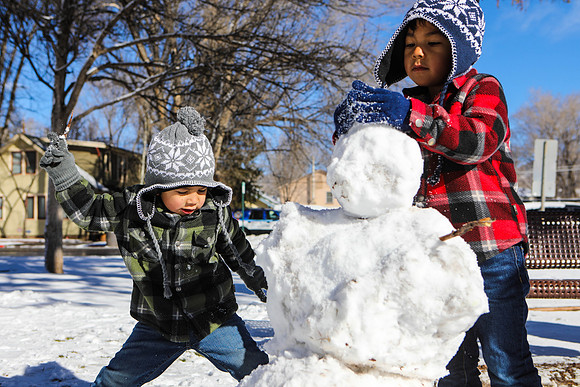Children Build a Snowman