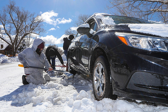Family Digs Out Buried Car