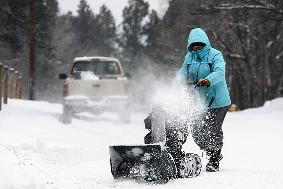 Woman Snow-Blows Her Driveway and Street
