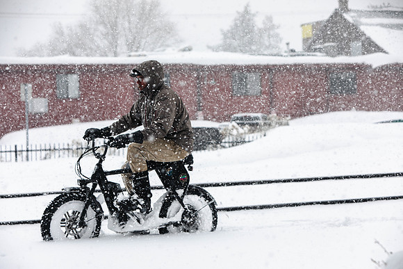 Man Cycles in the Snow