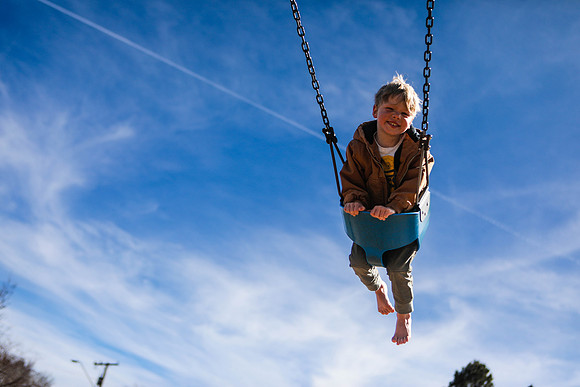 A Young Boy Enjoys the Warming Weather