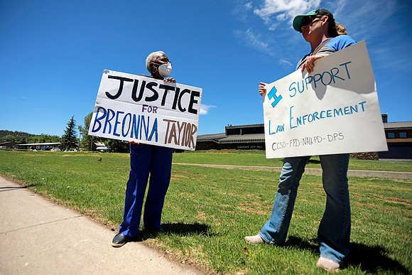Opposite Sides Discuss at Back the Blue Rally